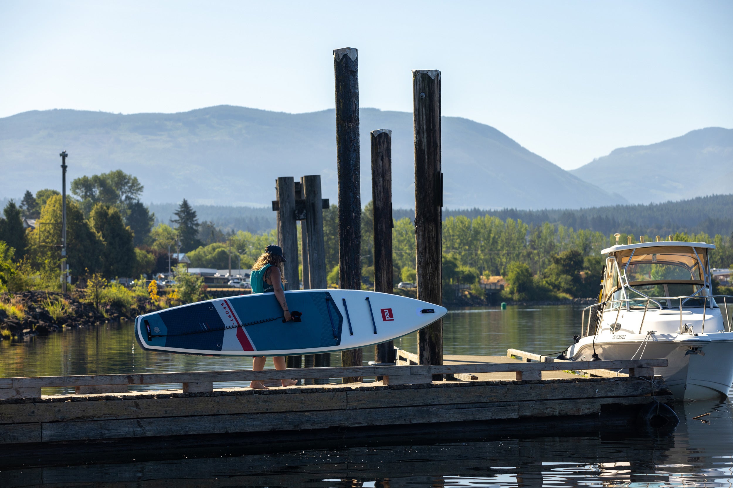 2025 Red Paddle Co 12'6 Sport+ lifestyle walking carrying board by water