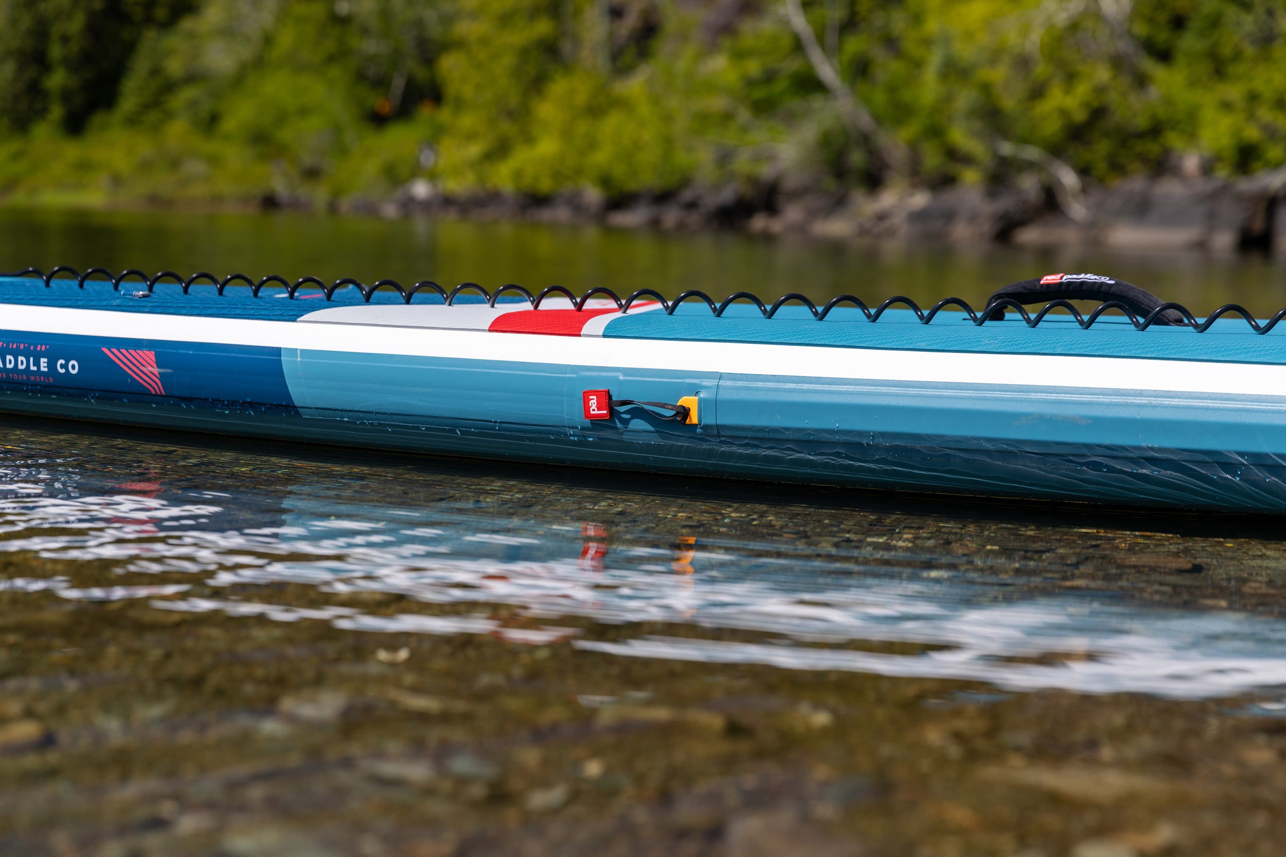 2025 Red Paddle Co 14'0 Sport+ floating on the water side view