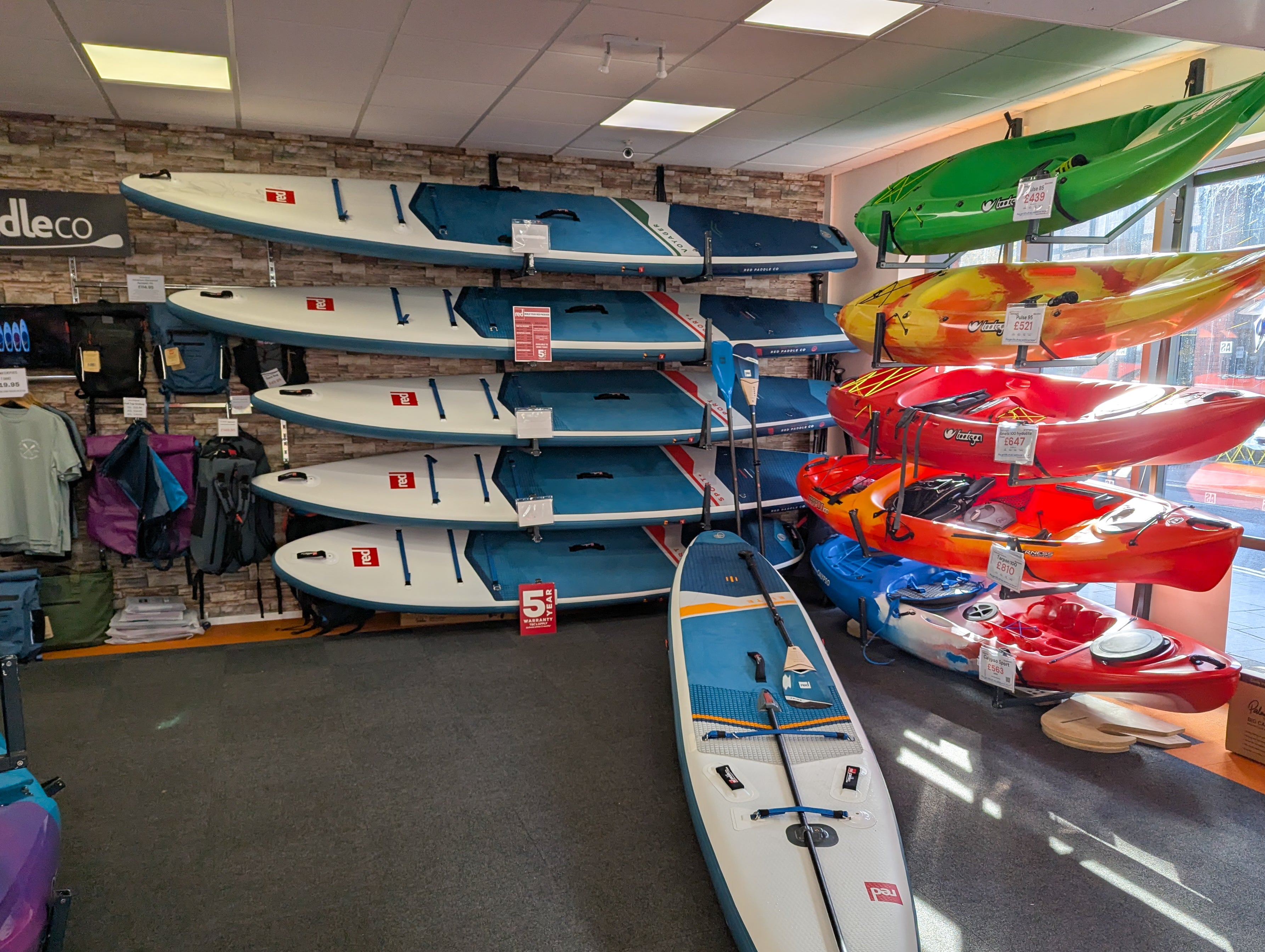 image of shop showing a range  of Red Paddleboards on an in-store display