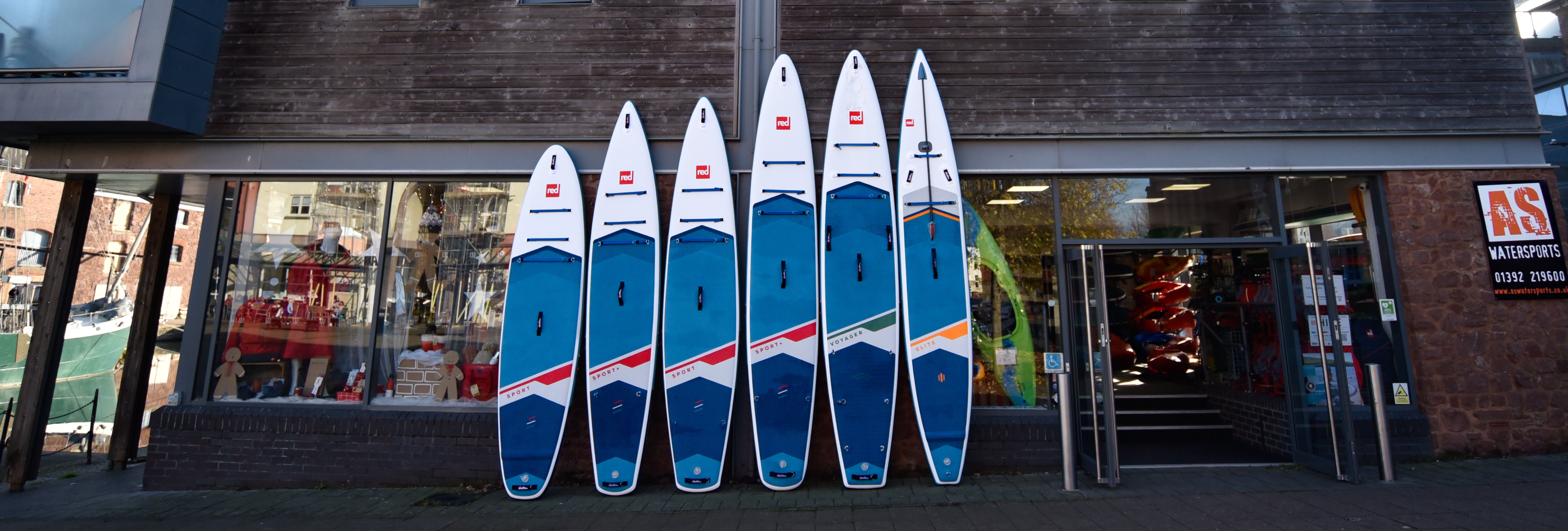 image of shop showing a range  of Red Paddleboards outside display