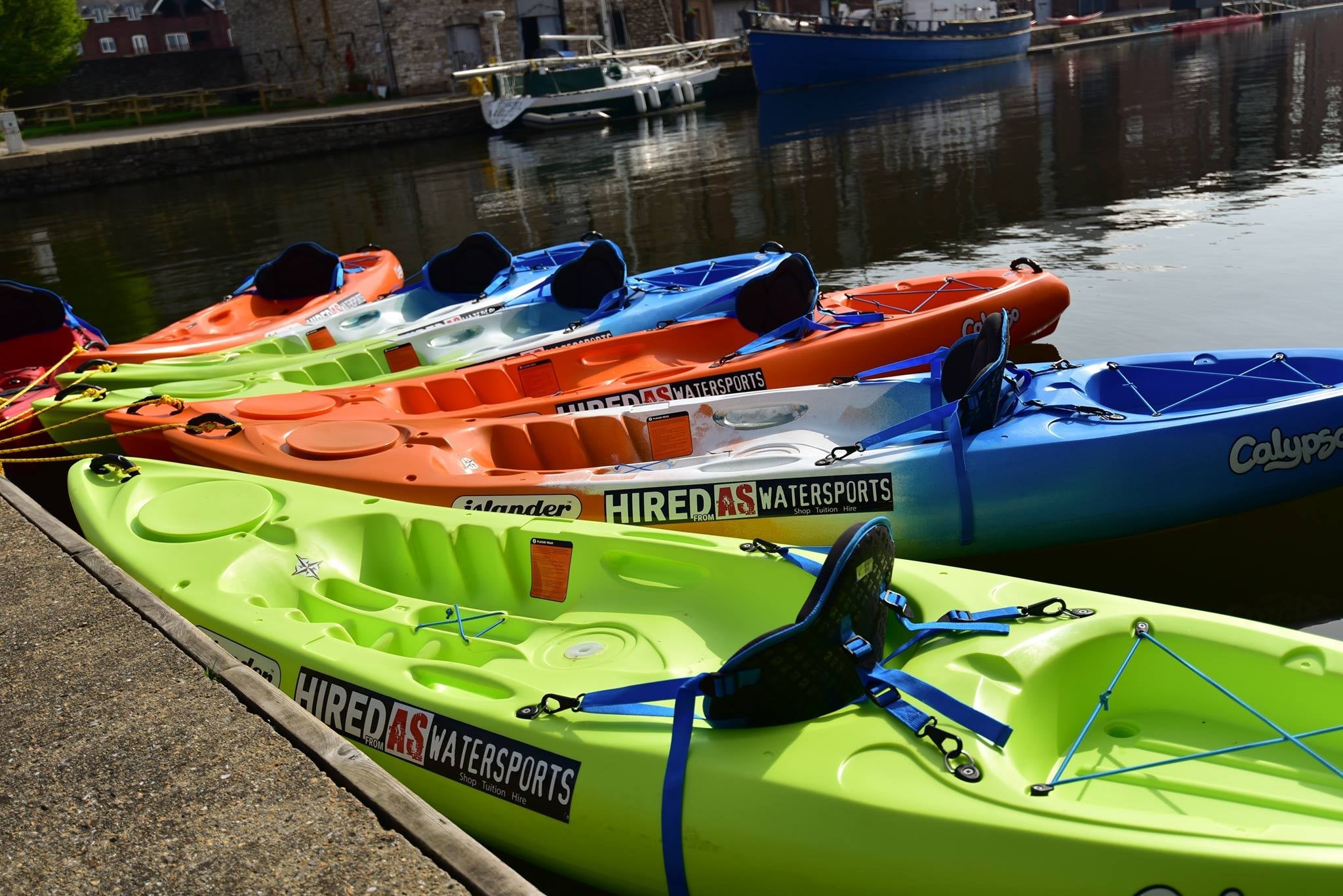 single sit on top kayaks lined up ready to hire on exeter canal