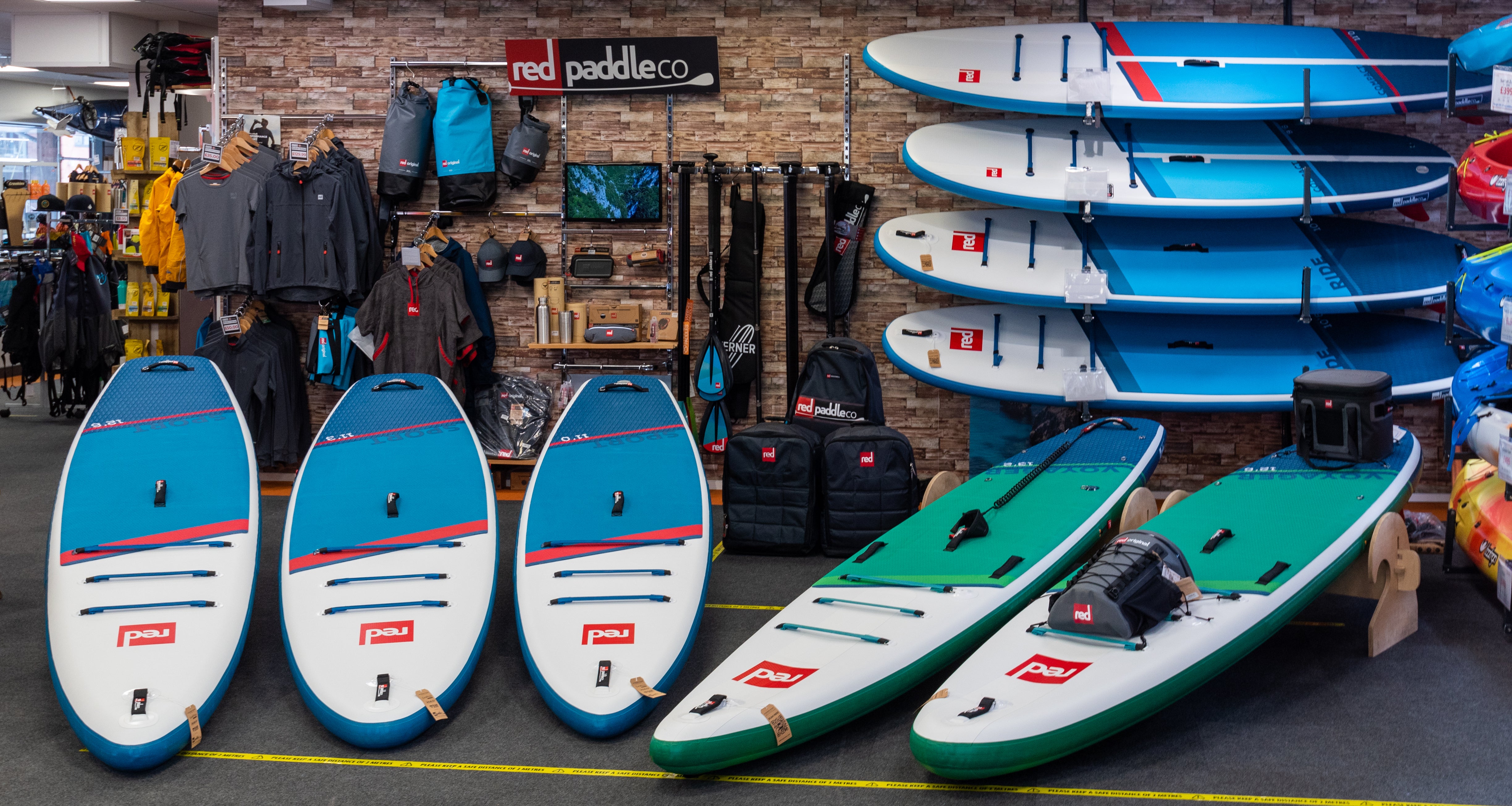 Banner showing in store display of a selection of Red Paddle co paddleboards